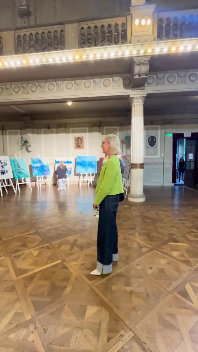Marina Elizalde in the auditorium in front of the works