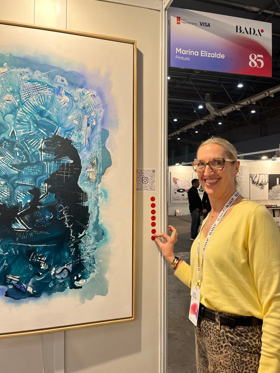 Marina Elizalde pointing at one of her works at BADA 2025