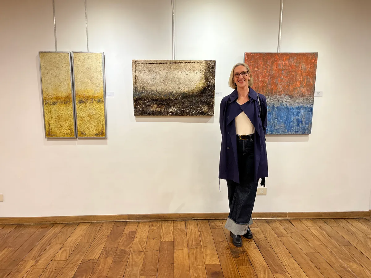 Marina Elizalde next to her works at the Club Alemán