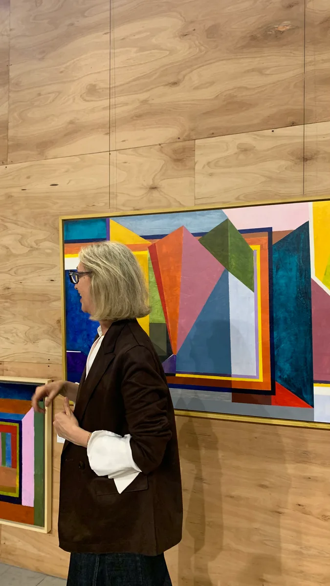 Marina Elizalde next to one of her paintings at TS&A Gallery