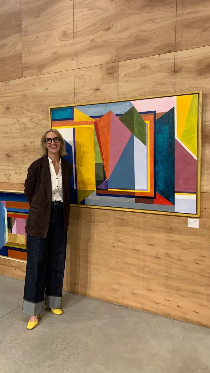 Marina Elizalde standing next to her work at TS&A Gallery